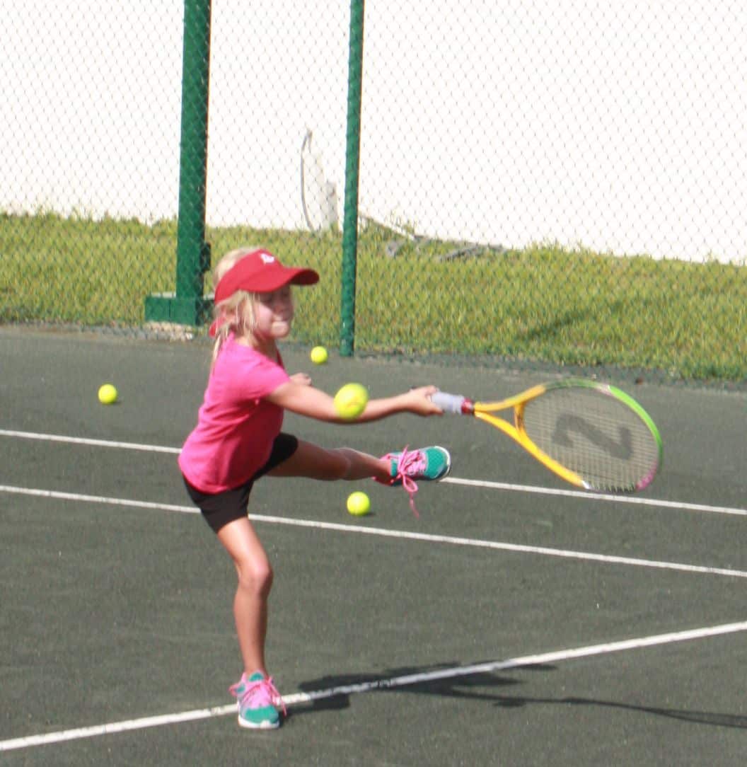 Young guest playing tennis at Casa Del Mar
