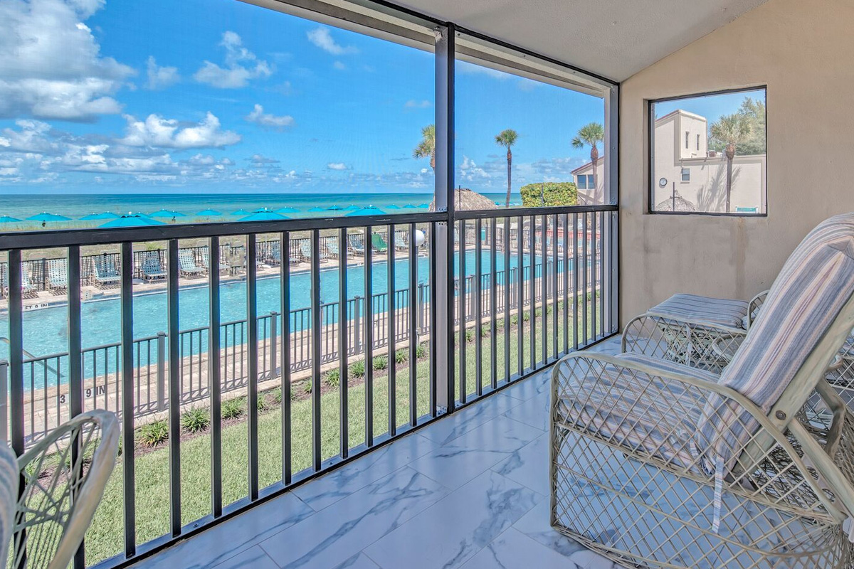 Poolfront Casa Del Mar rental balcony overlooking the pool and Gulf