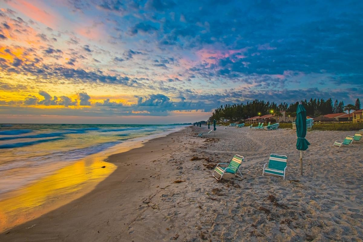 White sandy beach at Casa Del Mar on Longboat Key at sunset