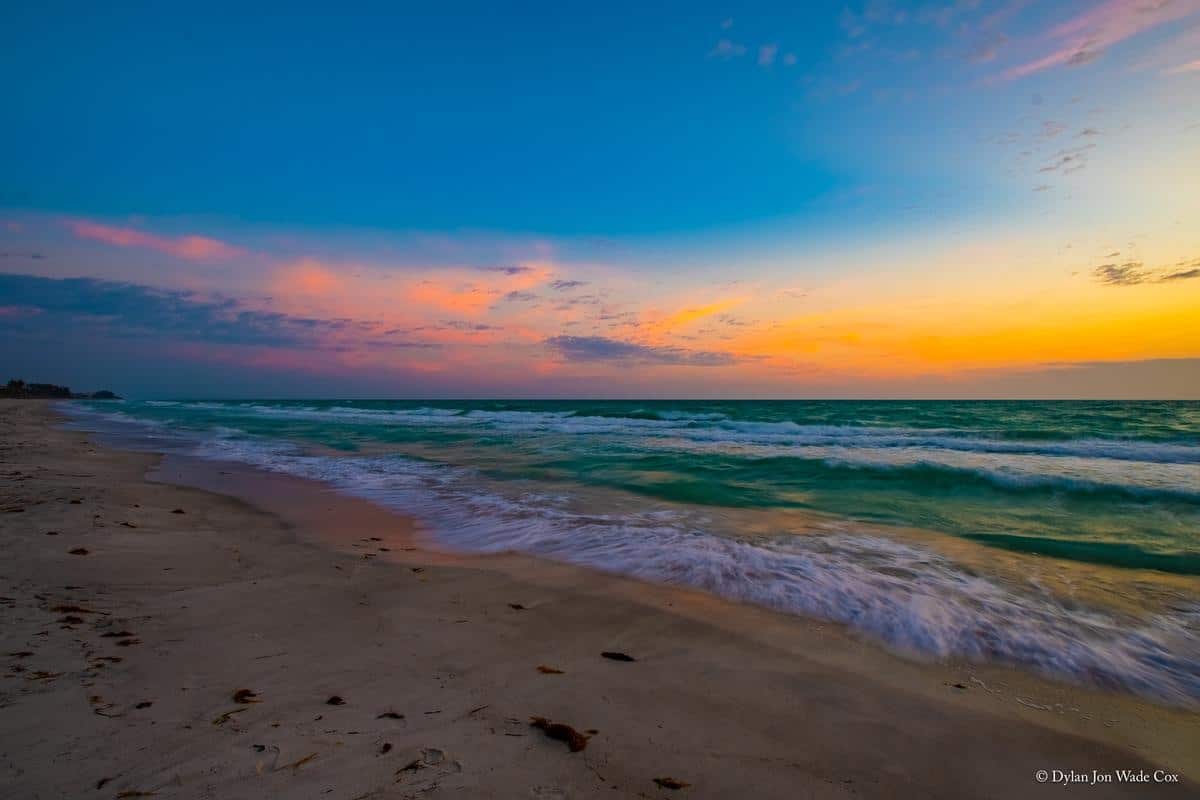 Gentle Gulf waves along the Longboat Key beach at sunset
